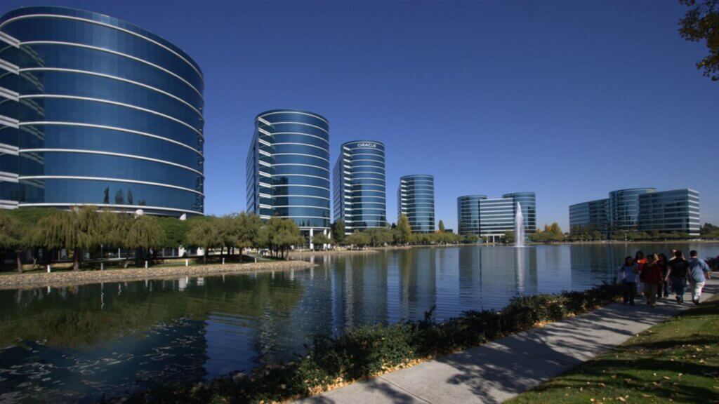 Oracle office campus buildings beside a lake in Redwood City, California.