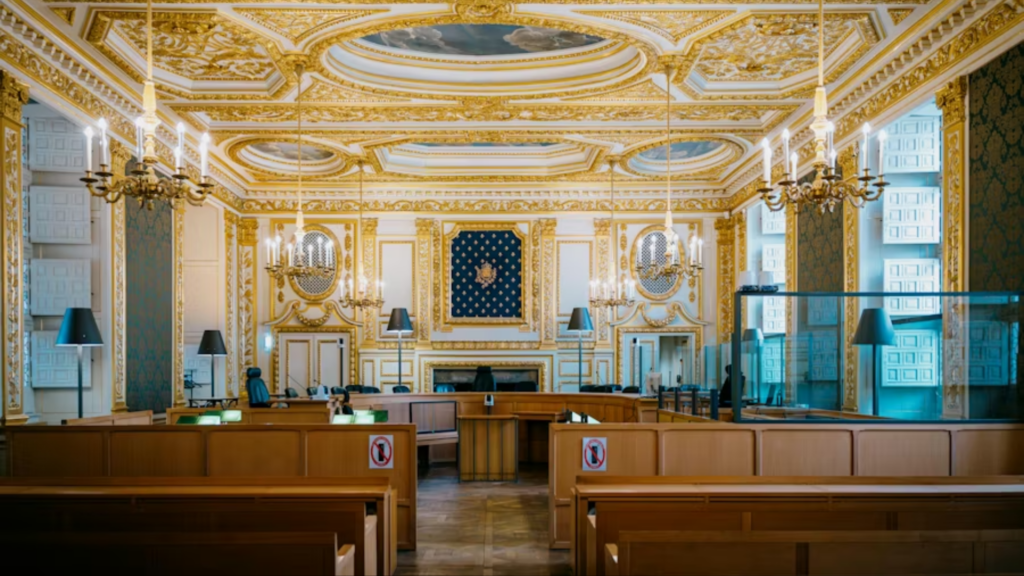 A wide-angle shot of the opulent interior of the Grand Chamber within the Palais de Justice in Paris.