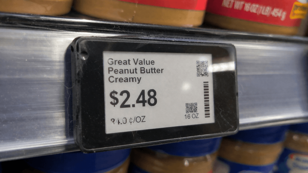 Close-up of a digital price tag on a grocery shelf showing product pricing.