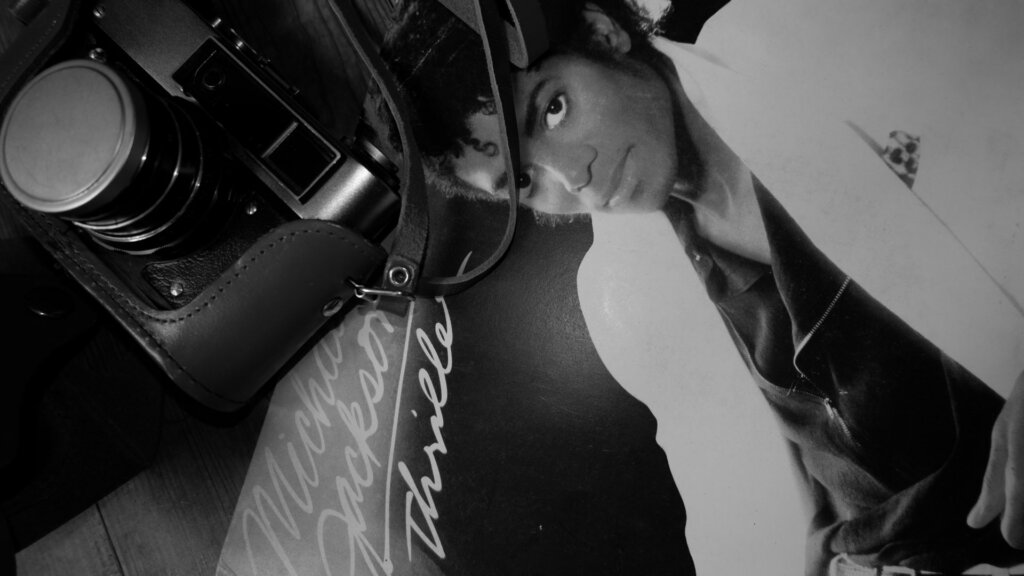 Michael jackson part of an album in black and white.