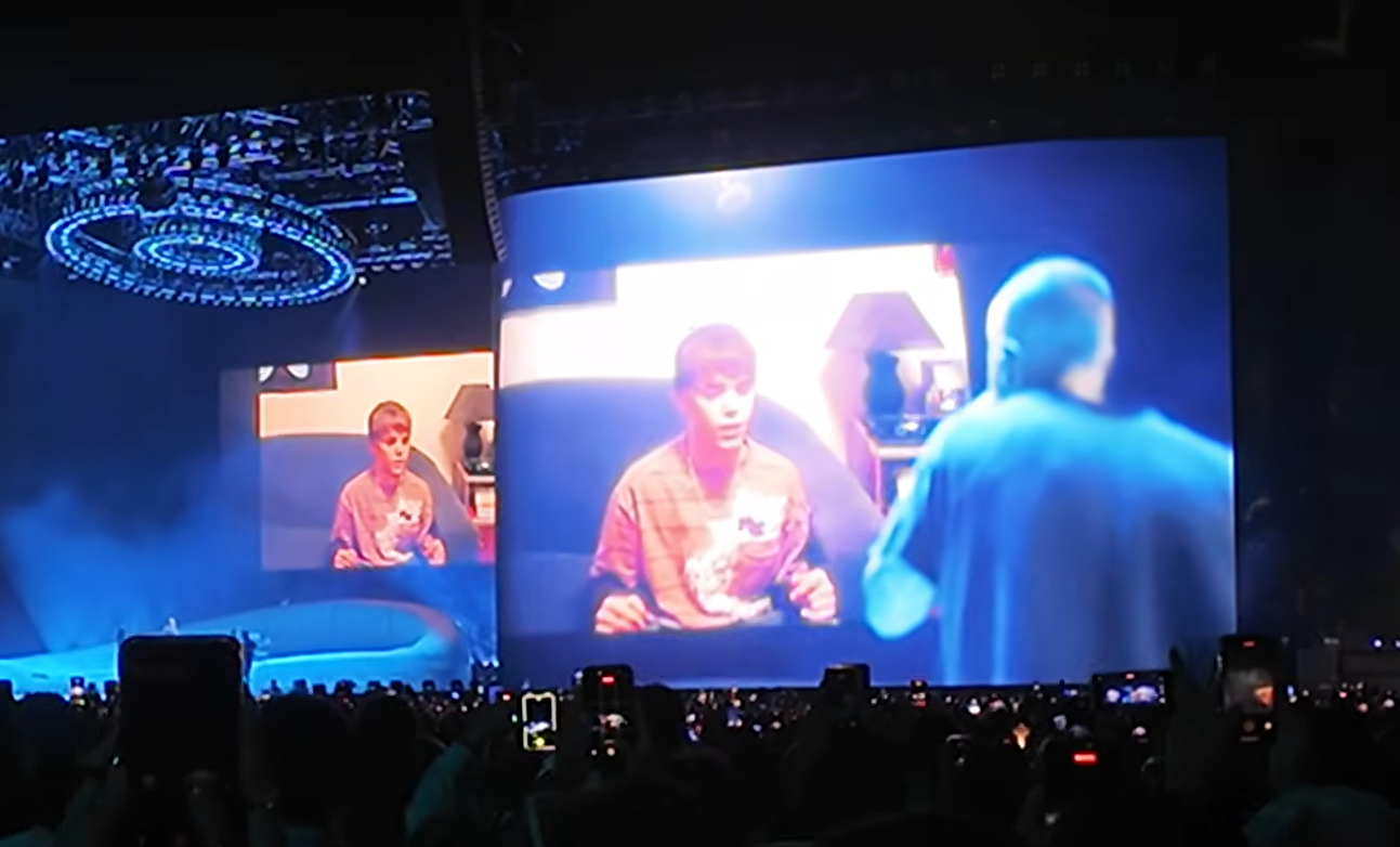Justin Bieber performing “With You” alongside footage of his younger self on large screens during his Coachella set.