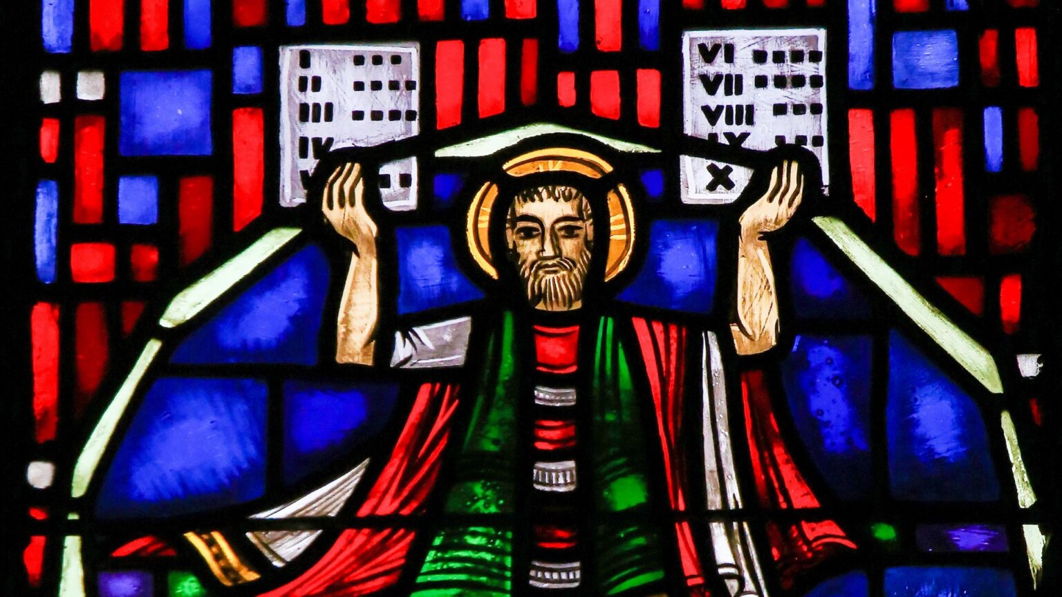 Stained glass depicting Moses with the Stone Tablets and the Ten Commandments.