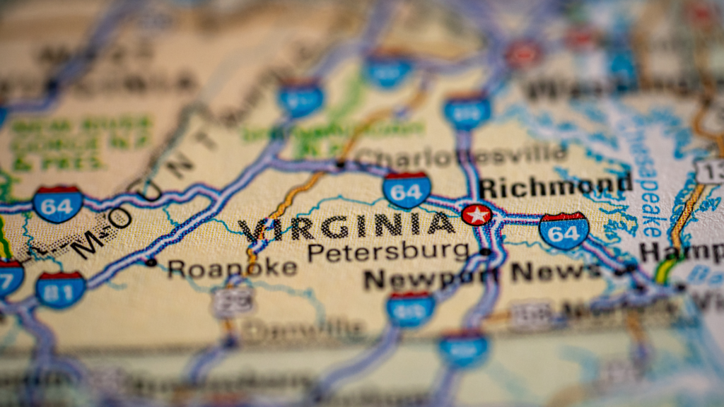A close-up view of a physical map of Virginia, with labels for cities like Richmond, Petersburg, and Roanoke clearly visible.