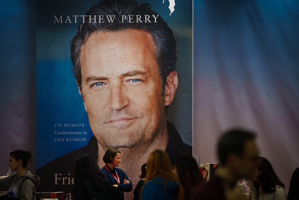 Matthew Perry memoir book cover displayed on large poster at event