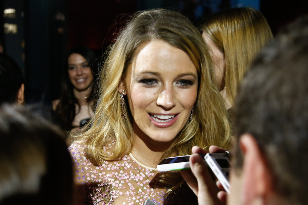 Blake Lively speaking to reporters on the red carpet at the Golden Heart Awards in New York City.
