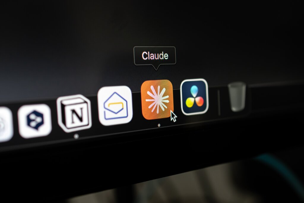 Computer dock showing Claude app icon highlighted among other applications.