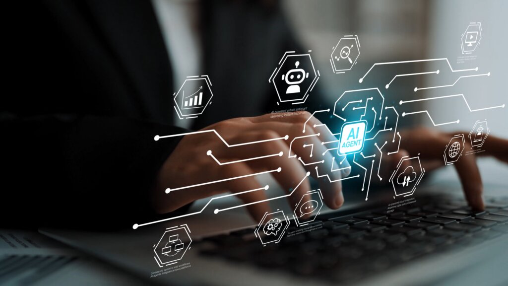 Hands typing on laptop with digital overlay of AI agent icons and connected data network graphics.