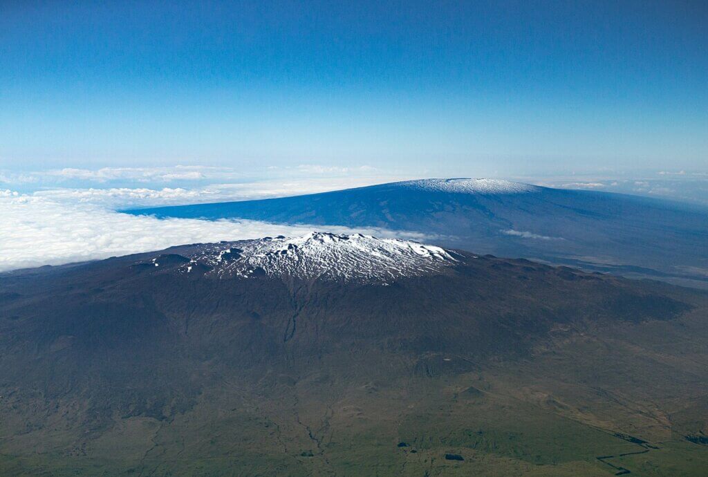 Aerial view of Maunakea in the foreground and Mauna Loa in the background, on the island of Hawai‘i.