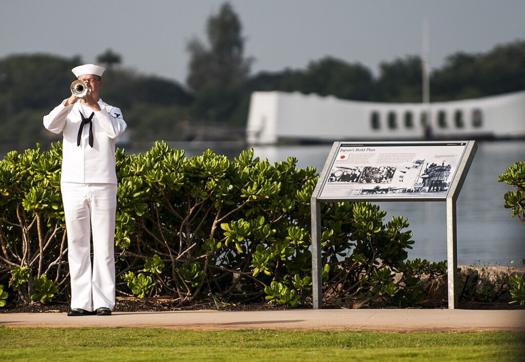 A U.S. Navy bugler plays taps during the 71st anniversary Pearl Harbor Day commemoration in Pearl Harbor, Hawaii.