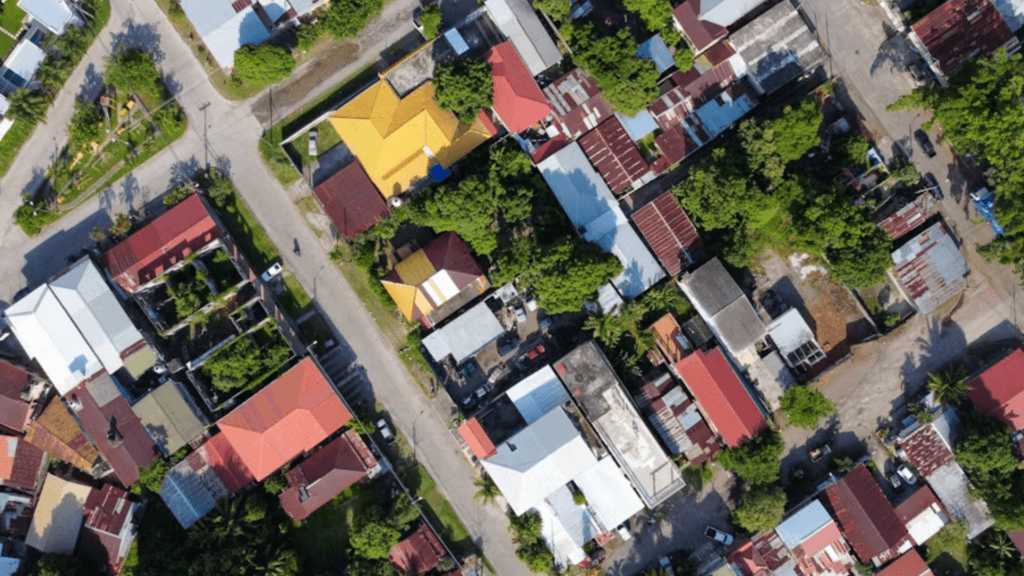Aerial view of a residential neighborhood with houses, streets, and trees.