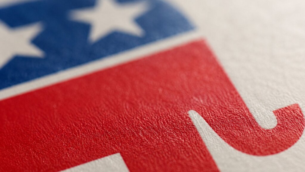 Close up of the Republican Party elephant logo with white stars on a blue background and red lettering.
