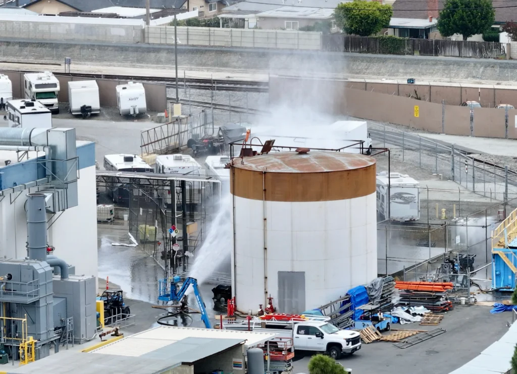 Water sprayed onto a pressurized methyl methacrylate tank at GKN Aerospace in Garden Grove.
