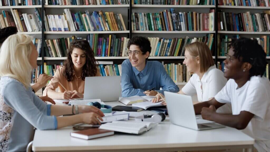 A group of students in a round table at college.