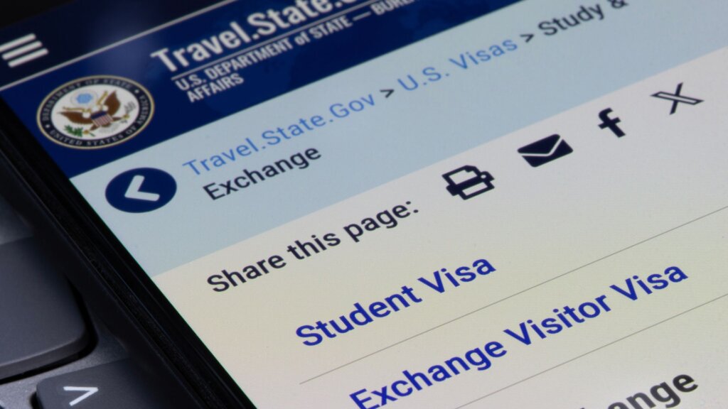 U.S. Department of State travel website showing student and visitor visa options on a phone screen.