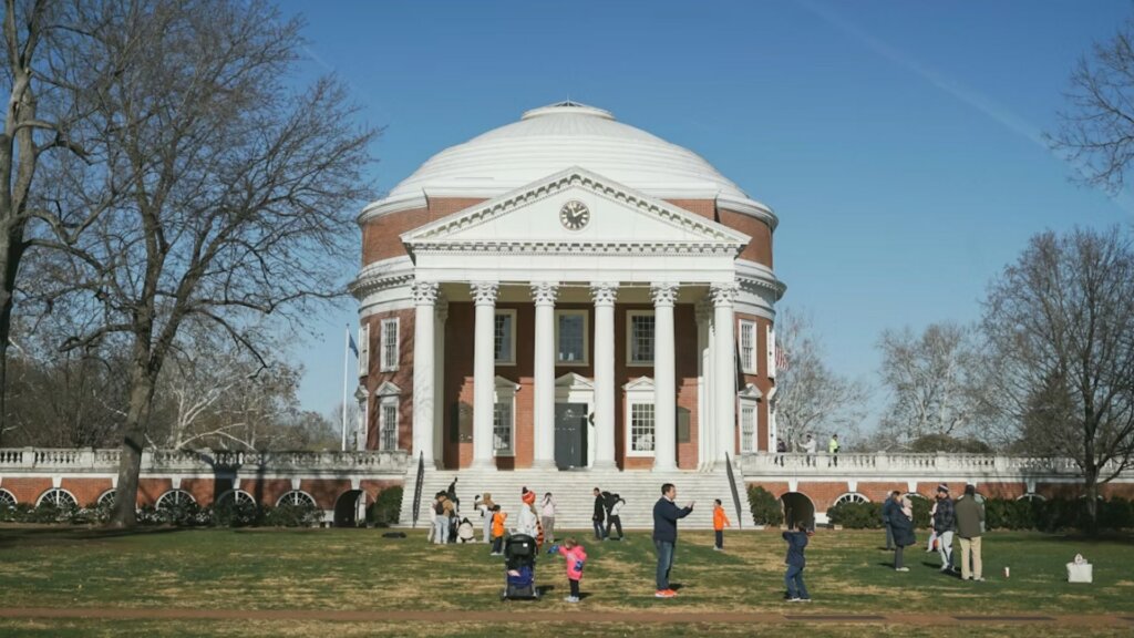 University of Virginia Rotunda building with people on the lawn.