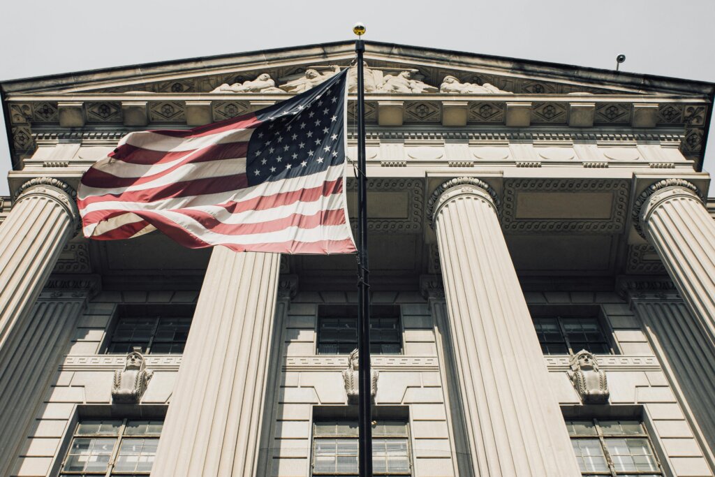 American flag flying in front of the US Supreme Court.