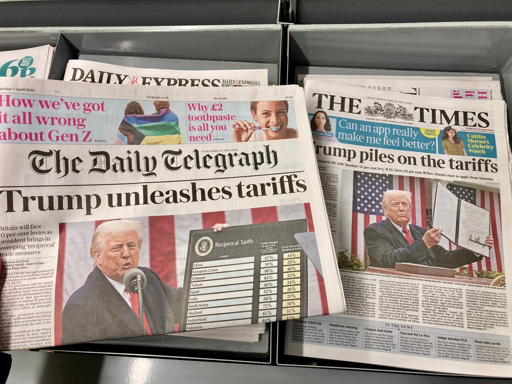 British newspapers display front-page coverage of President Donald Trump's new tariffs.