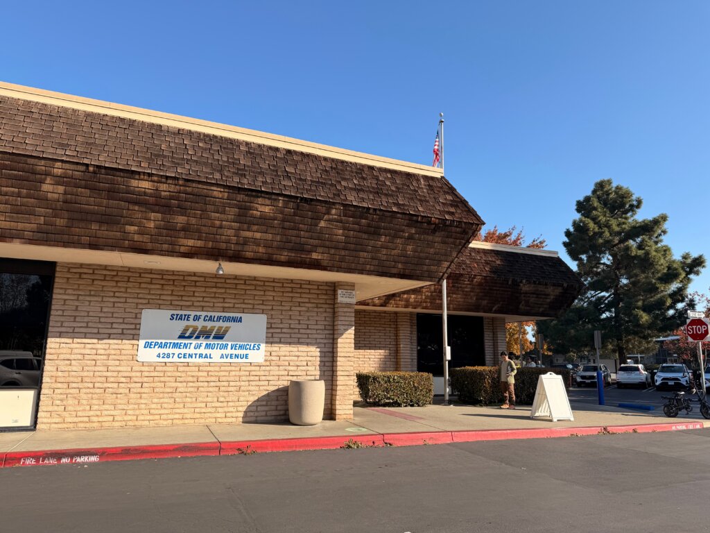 California Department of Motor Vehicles office building with DMV signage outside.