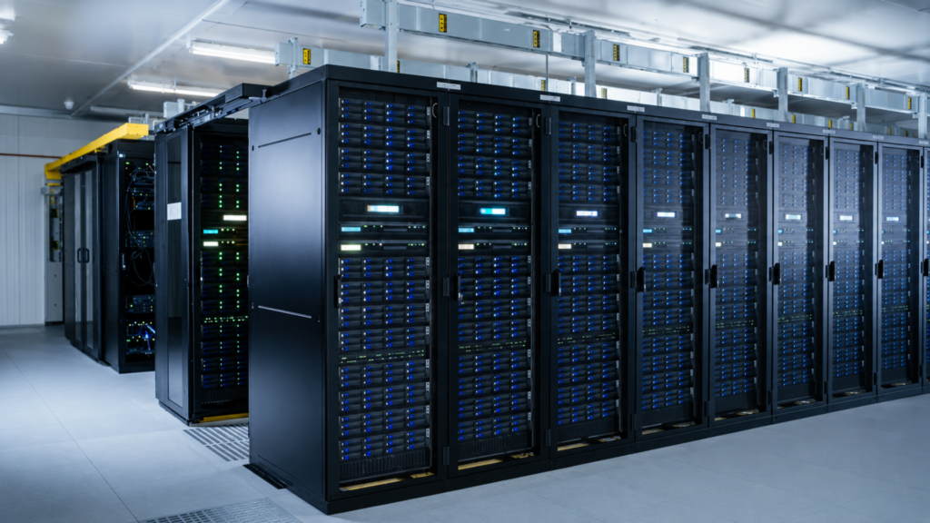 Rows of server racks with blue indicator lights inside a data center.
