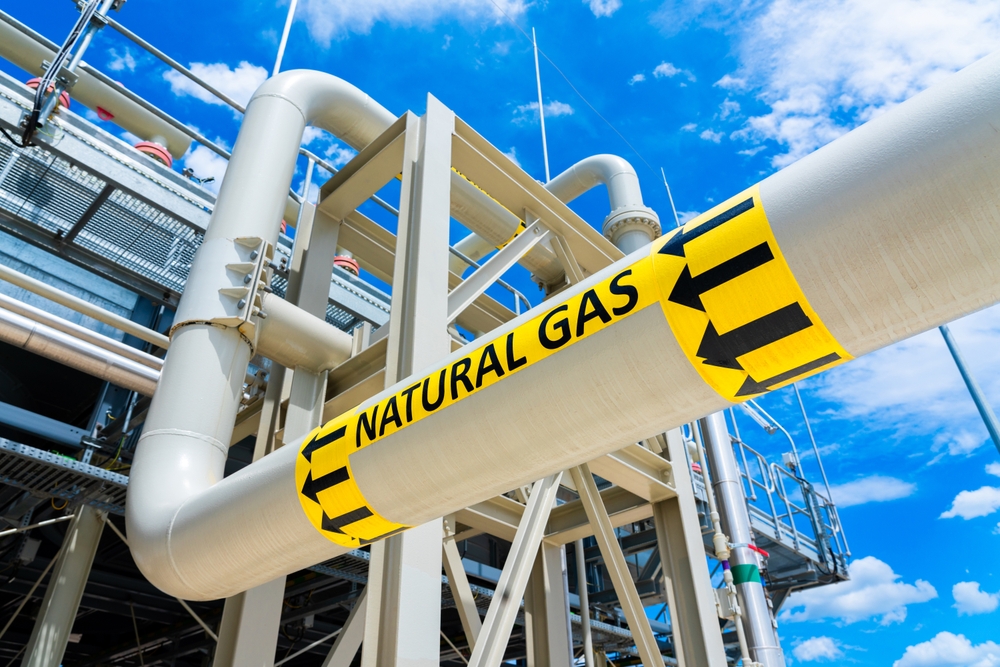 Natural gas pipeline infrastructure with a labeled gas transmission pipe at an industrial facility.