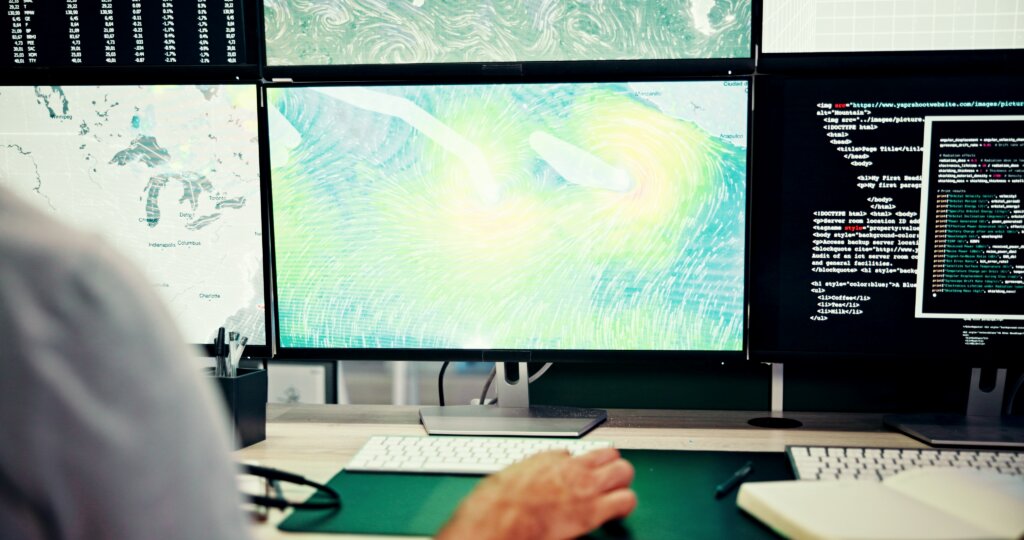 A person in the national hurricane center working in the computer.