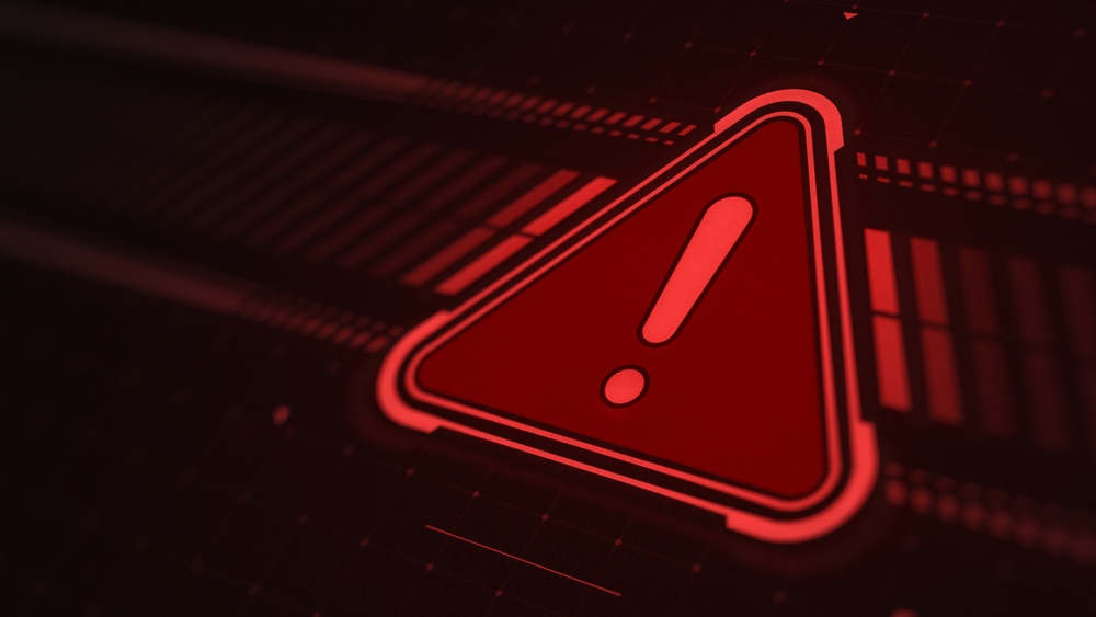 Red warning symbol with an exclamation mark on a digital interface, illustrating a data breach or cybersecurity incident.