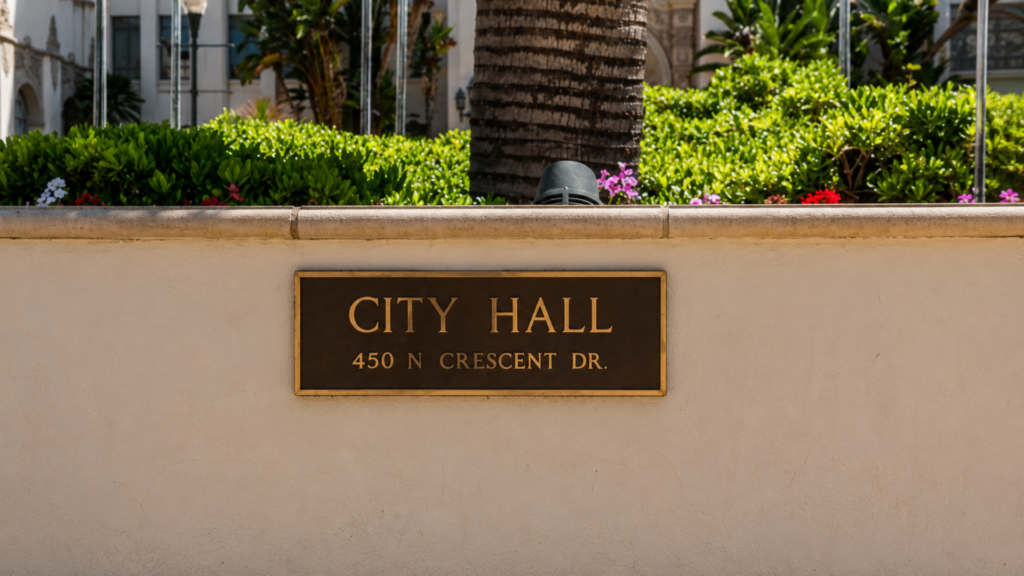 A bronze plaque displaying the address "City Hall 450 N Crescent Dr."