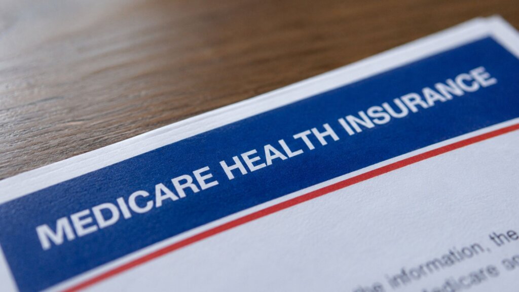 Close up of a Medicare health insurance document with the heading “MEDICARE HEALTH INSURANCE” clearly visible across the top.