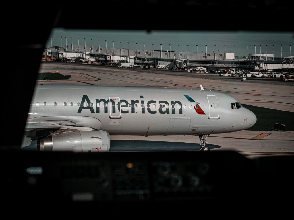 An American Airlines aircraft is parked at an airport gate.