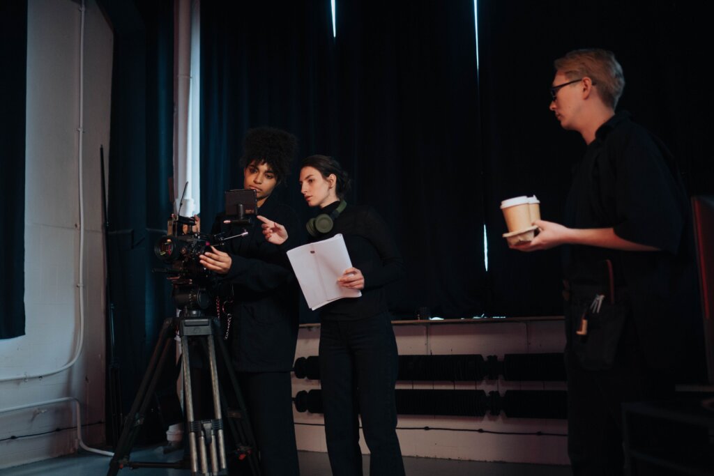 Film crew preparing camera equipment on a production set.