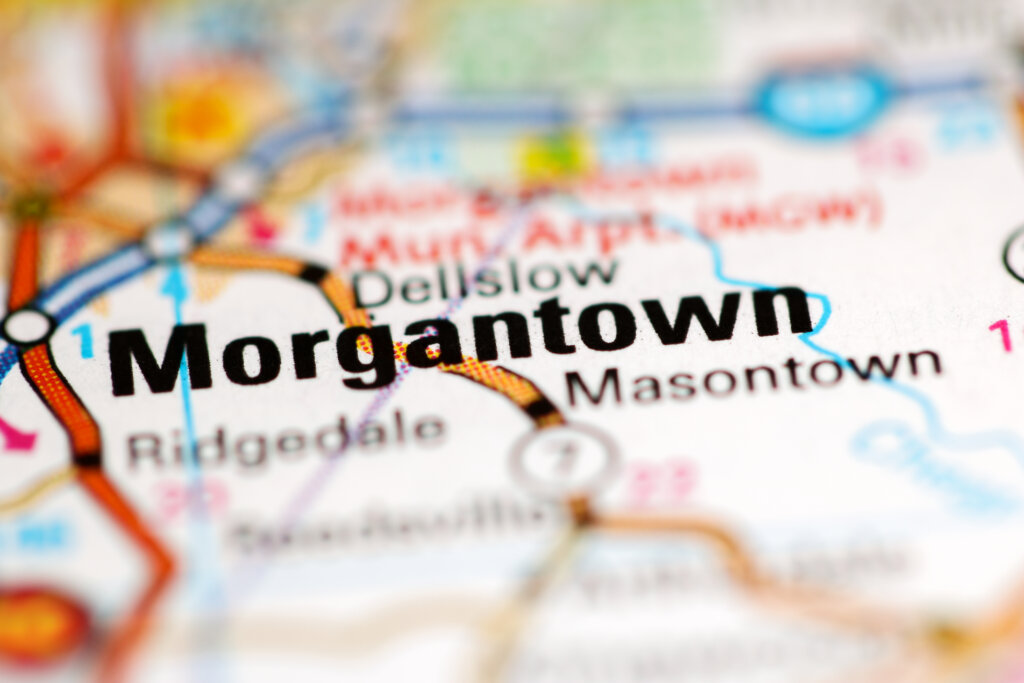Close-up of a printed map highlighting Morgantown, West Virginia, the city at the center of the debate over hostile architecture and public bench design.