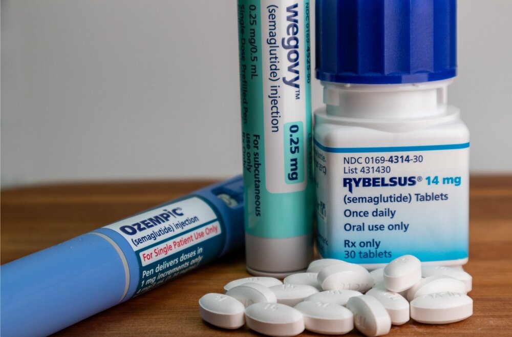 Ozempic and Wegovy injection pens displayed alongside Rybelsus tablets, all containing semaglutide.
