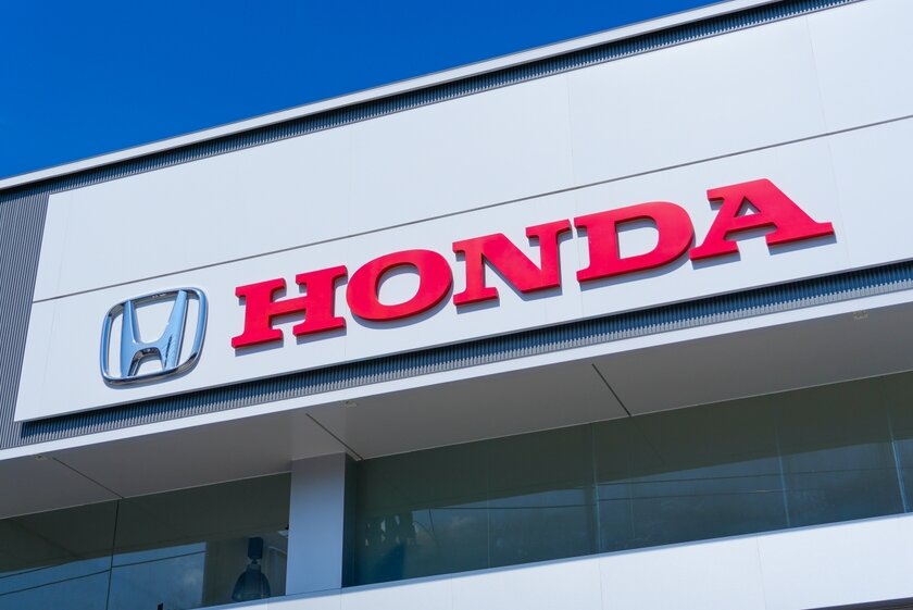 Honda logo displayed on the exterior of a dealership building.