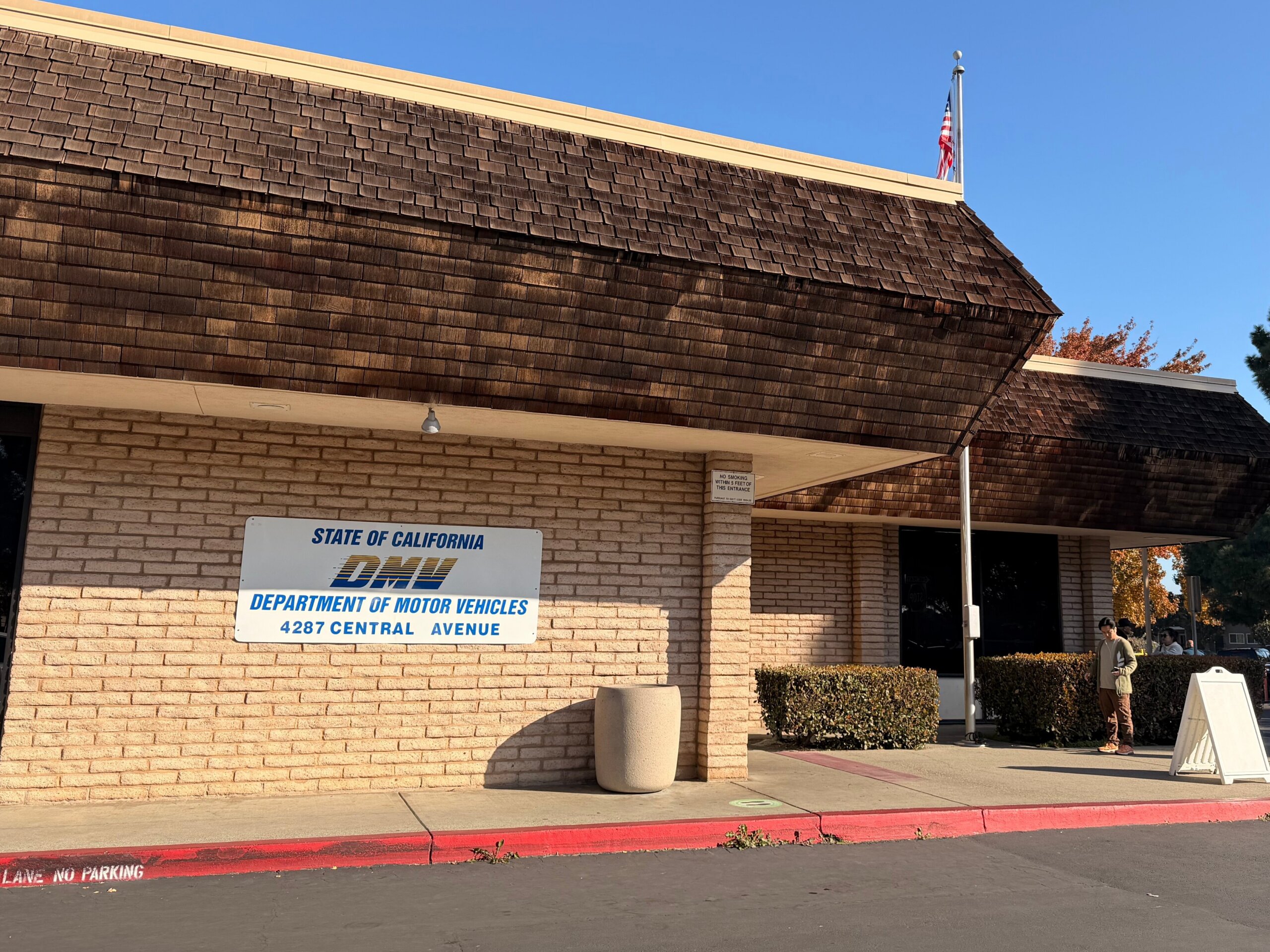 California Department of Motor Vehicles office building with DMV signage outside.