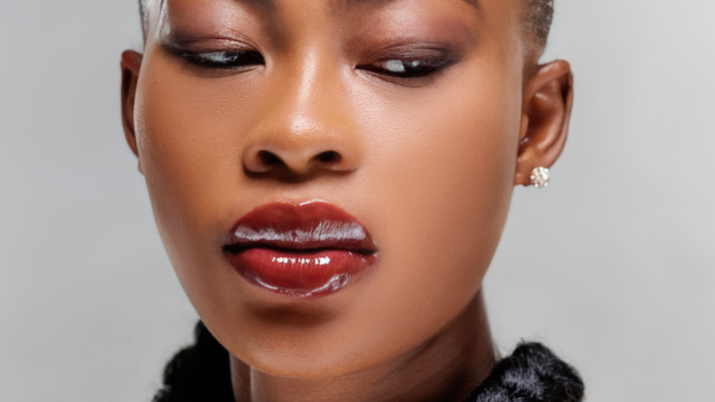 Close-up of glossy, glass-like lips capturing the nostalgic beauty trend making a comeback