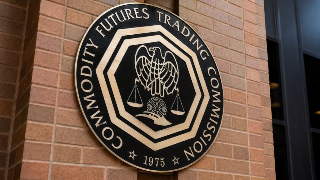 A large black and gold seal mounted on a brick wall reads "COMMODITY FUTURES TRADING COMMISSION 1975."