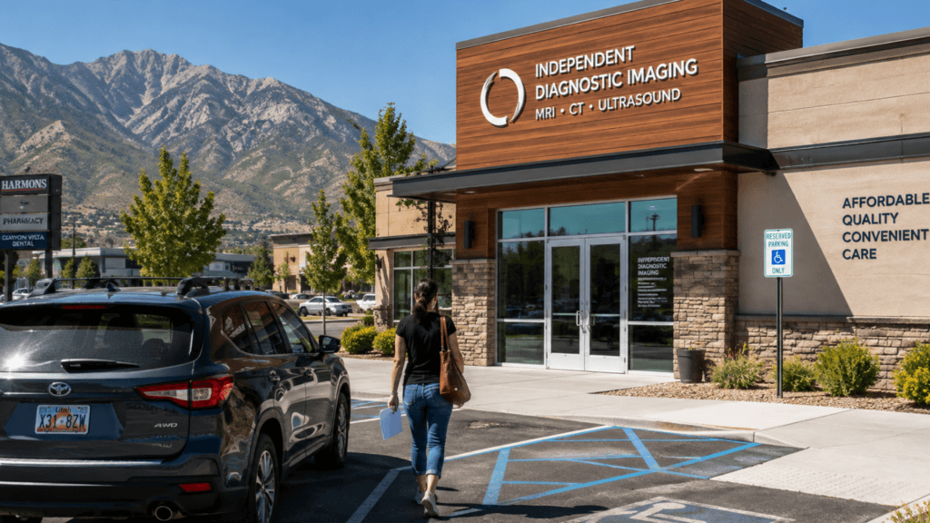 A woman walking toward the entrance of an Independent Diagnostic Imaging center building.