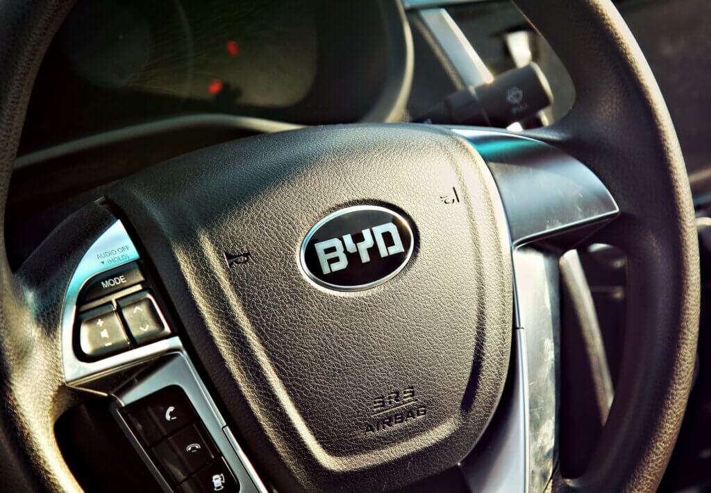 BYD logo displayed on the steering wheel of a BYD vehicle.