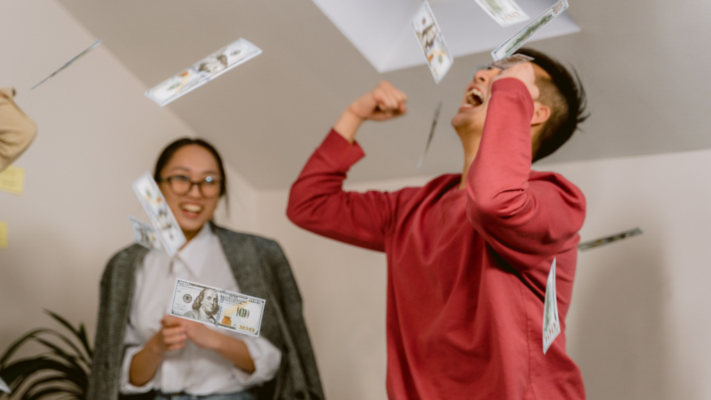 A jubilant hourly worker tosses cash in the air, capturing the surprising wave of job-switchers cashing in on the biggest pay bumps in years.