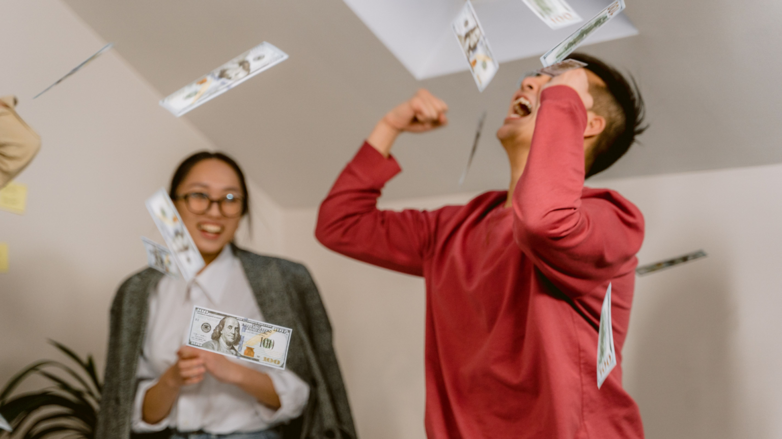 A jubilant hourly worker tosses cash in the air, capturing the surprising wave of job-switchers cashing in on the biggest pay bumps in years.