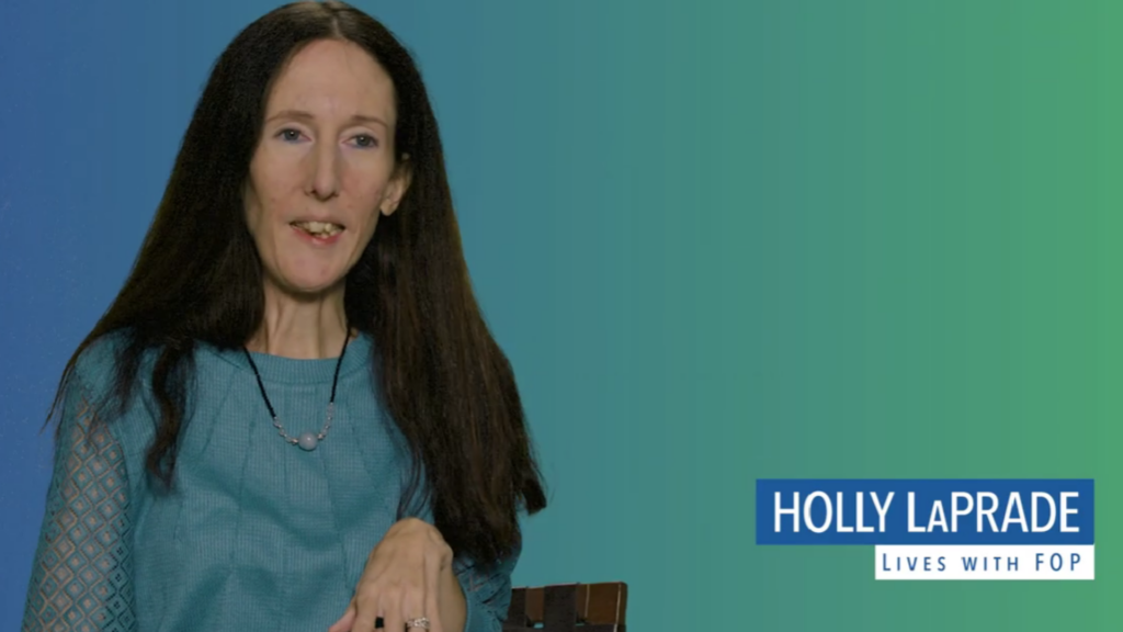 Holly LaPrade, a writer, wife, stepmom, and longtime FOP community member. Diagnosed with fibrodysplasia ossificans progressiva (FOP) at 16, Holly has built a vibrant, fulfilling life—despite the challenges of this ultra-rare condition.