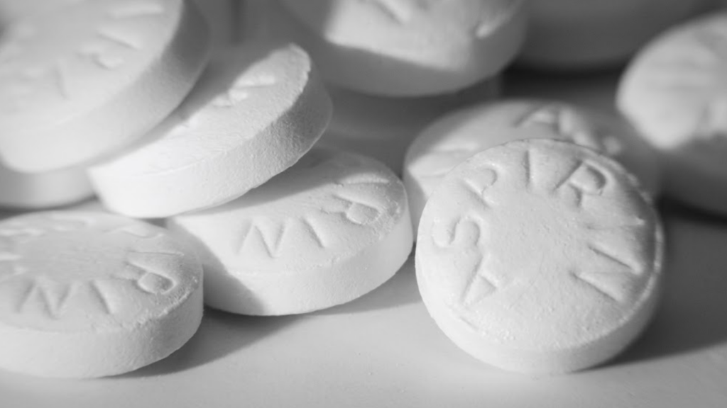 Macro shot of white asiprin on white background.
