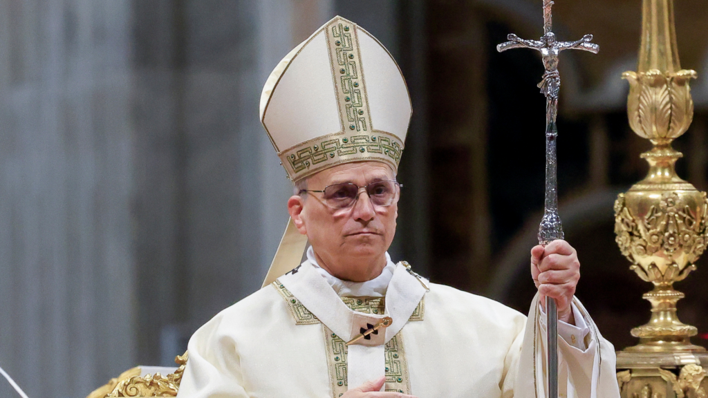 Pope Leo XIV in liturgical vestments holding a pastoral staff.