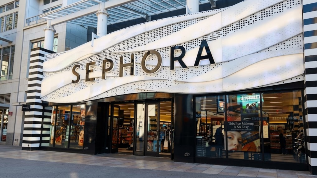 A Sephora storefront with large signage and glass entrance doors displays beauty products and cosmetics inside.