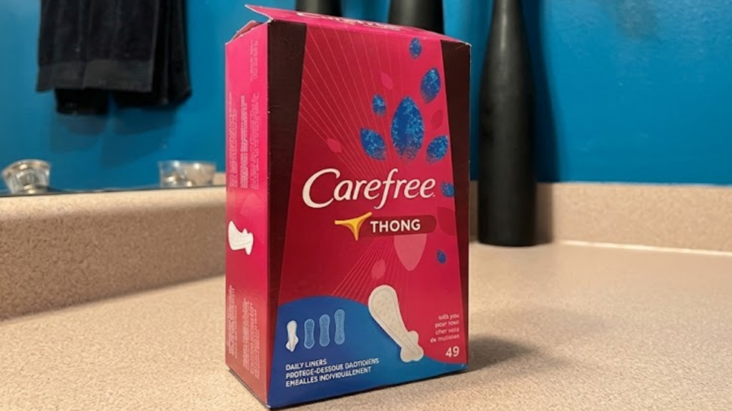 Open box of Carefree brand on a bathroom counter.