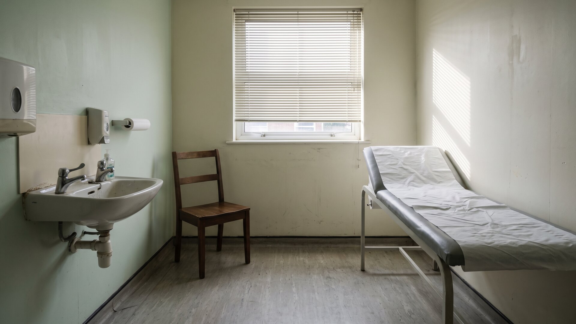 An environment frame of a clinic consulting room, matching slide 10's closing point that decisions belong with a clinician rather than an animal study.