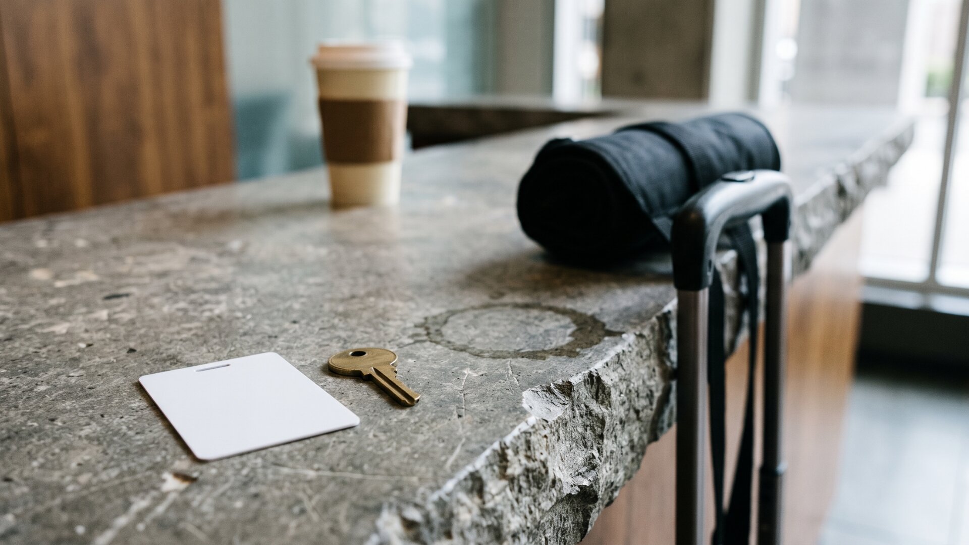 A hotel-style key card and keys left on a counter at departure, the frictionless checkout travelers are comparing against.