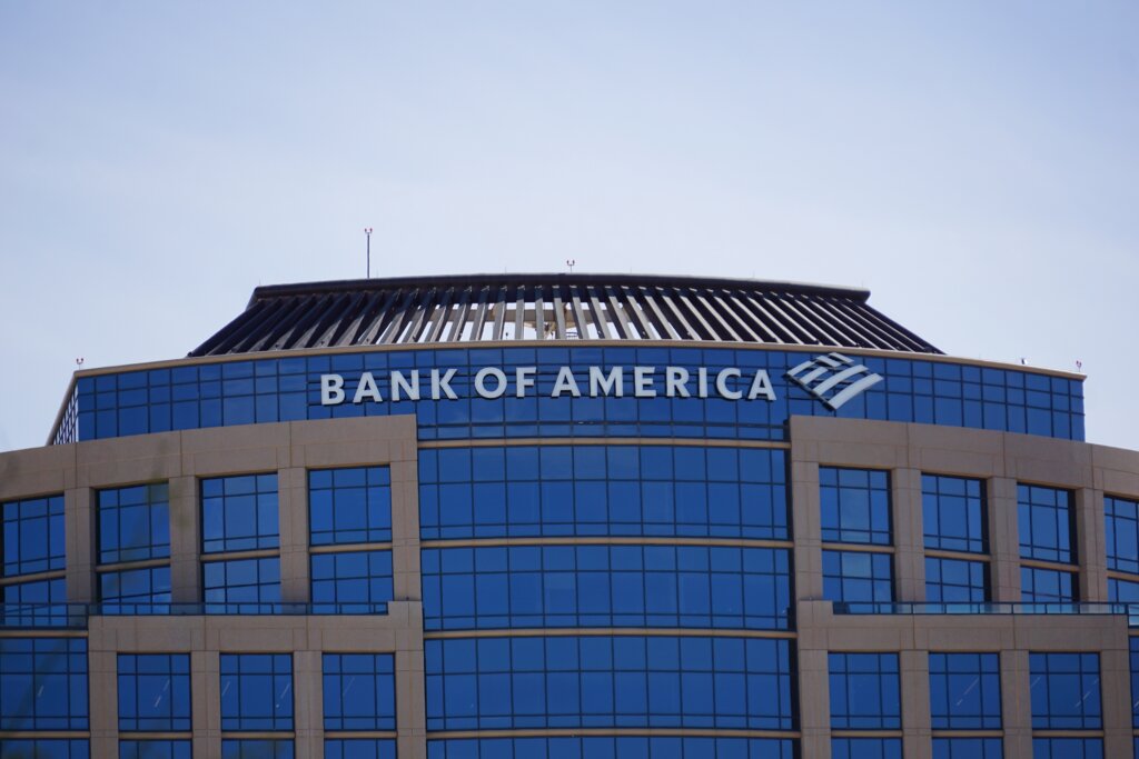 Bank of America logo displayed on the glass facade of a modern office building.