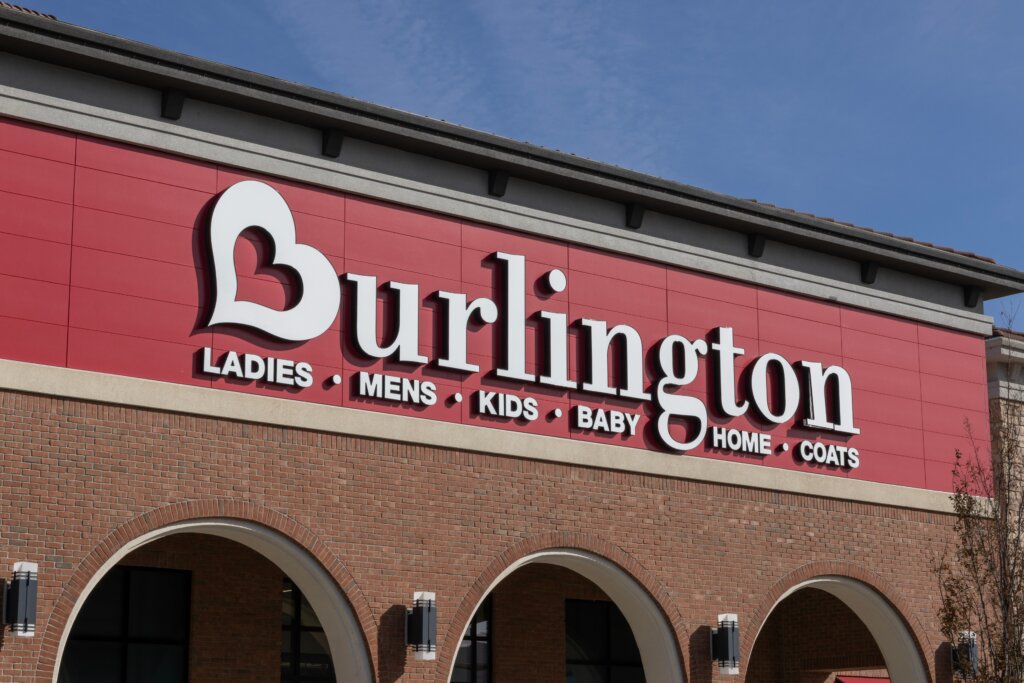 Exterior of a Burlington store featuring its large white logo on a red storefront.